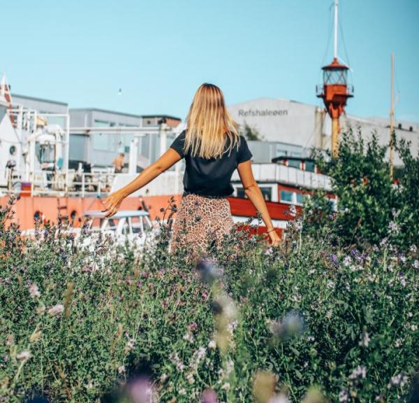 Woman wandering at Reffen street food market in Copenhagen