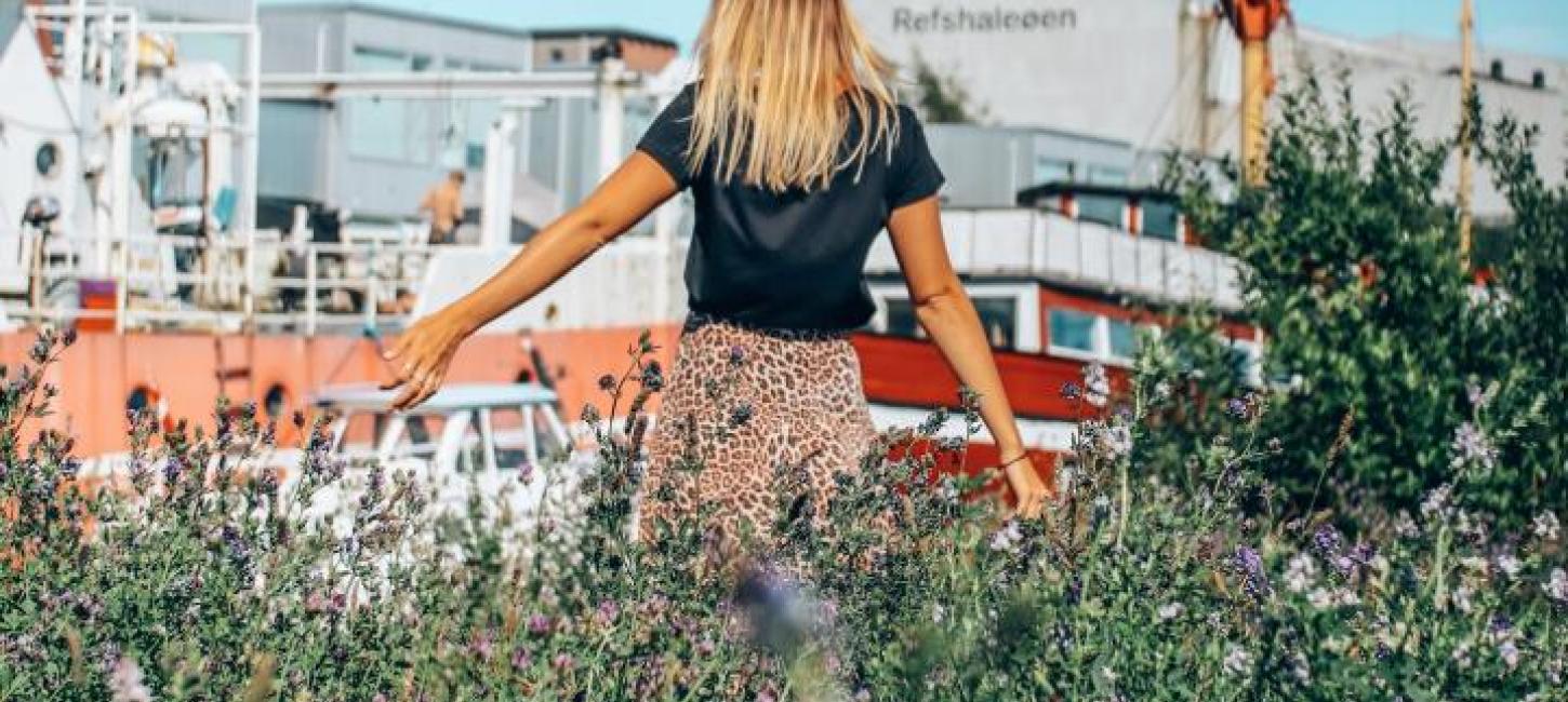 Woman wandering at Reffen street food market in Copenhagen