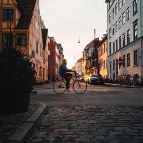 Girl biking in the neighbourhood of Christianshavn in Copenhagen