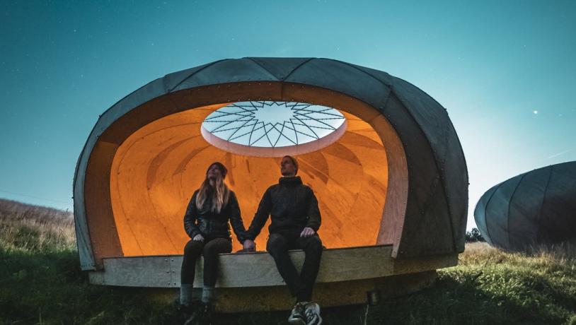 People sitting in a shelter at Brorfelde Observatory, West Zealand 