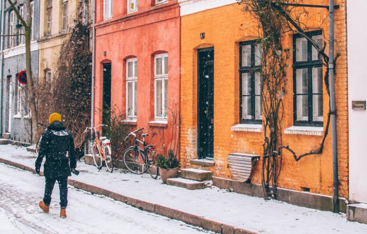 Colourful terraced houses in Copenhagen in winter, snow on the ground