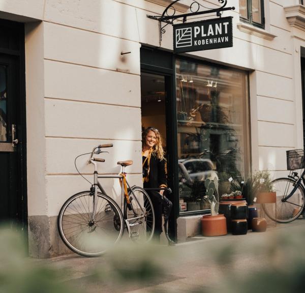 Woman shopping the plant shop in Jægerborggade, Nørrebro, Copenhagen