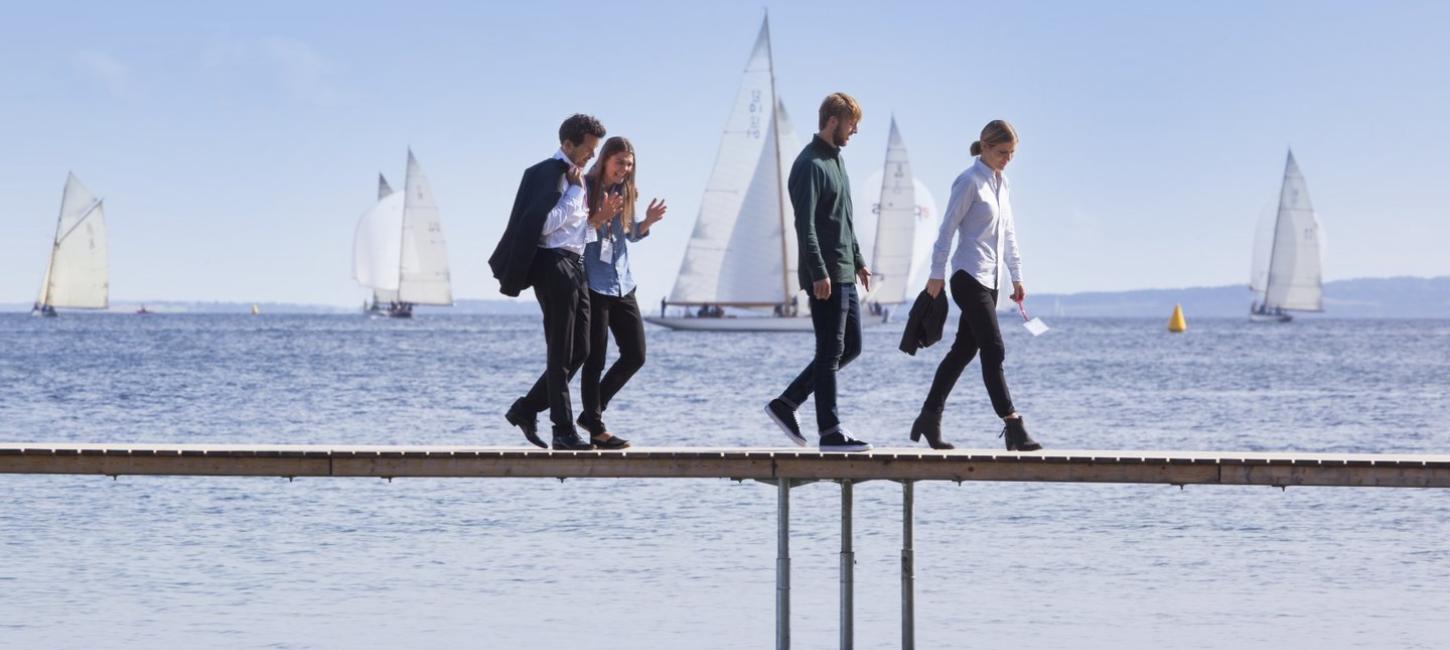 Business people walking on Aarhus infinite bridge