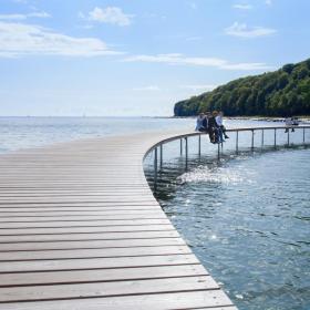 Business events delegates sitting on the Infinity bridge in Aarhus, Denmark