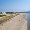 The beach in Esbjerg with the sculpture Men by the Sea