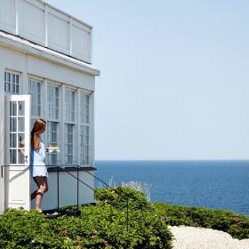 A woman walks out of Helenekilde Badehotel in North Zealand, Denmark