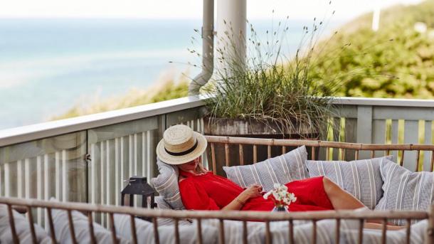 A woman relaxes at the luxury beach hotel Helenekilde Badehotel in North Zealand, Denmark