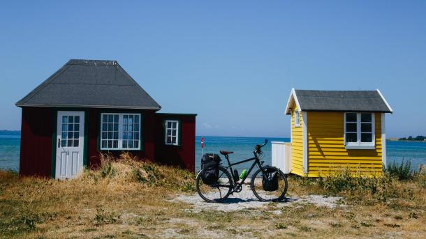 A stop by the beach cabins on Ærø while cycling the Baltic Sea Cycling Route in Denmark