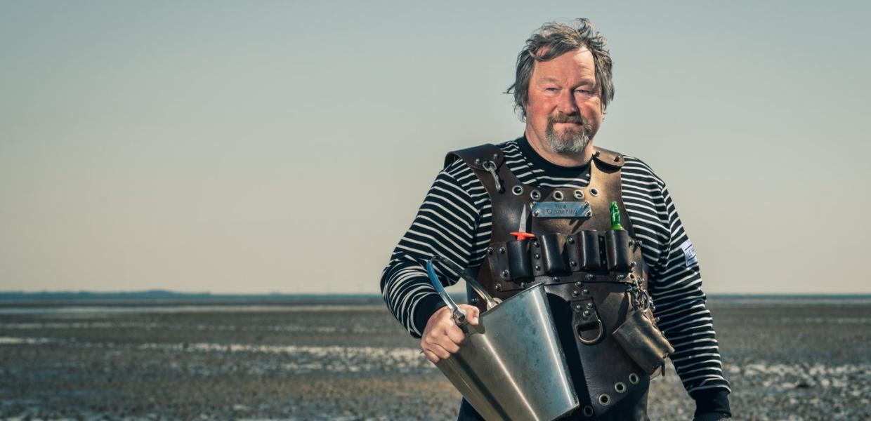 The Oyster King picking oysters in The Wadden Sea